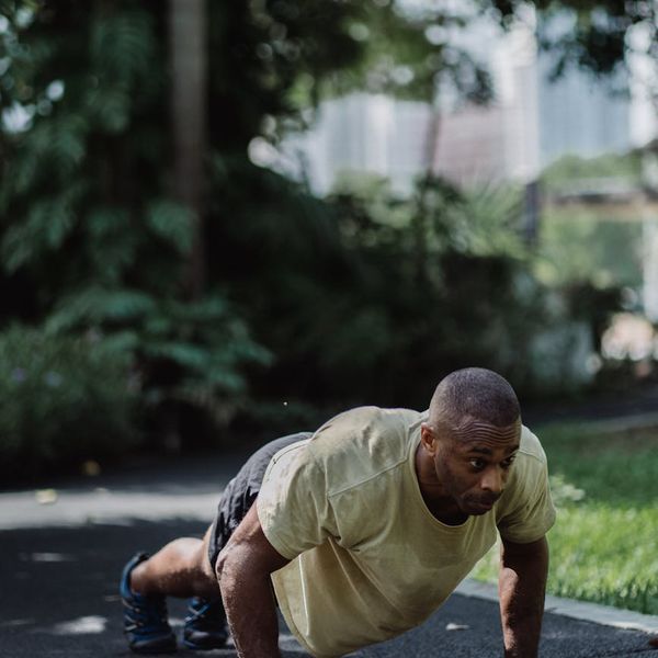 Close-up of a man's focused expression during a challenging exercise.