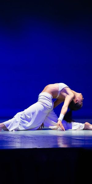 Side view of a man performing a slow, controlled movement.